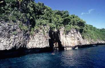 Pictured is the entrance to Mariner's Cave at Vava'u Islands, Tonga in the South Pacific ... a destination for snorkelers, divers, and  adventurous "free" swimmers.  To gain entrance to the cave proper, one must swim about a meter down, them about four meters in. The cave was named for William Mariner who used to tell of the legend of the young noble who hid his sweetheart in the cave to keep her safe from the ill intentions of a despotic king; the young man finally was able to get her to Fiji (and safety) via canoe.  Photo by Stefan Heinrich.  It's used courtesy of the GNU Free Documentation 1.2 License. 